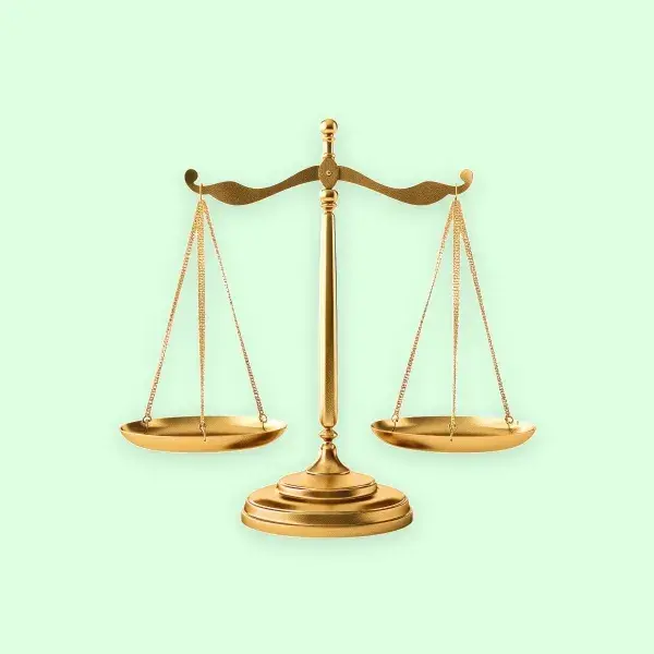 A gold balance scale on a light green background, symbolizing justice, fairness, or equality.