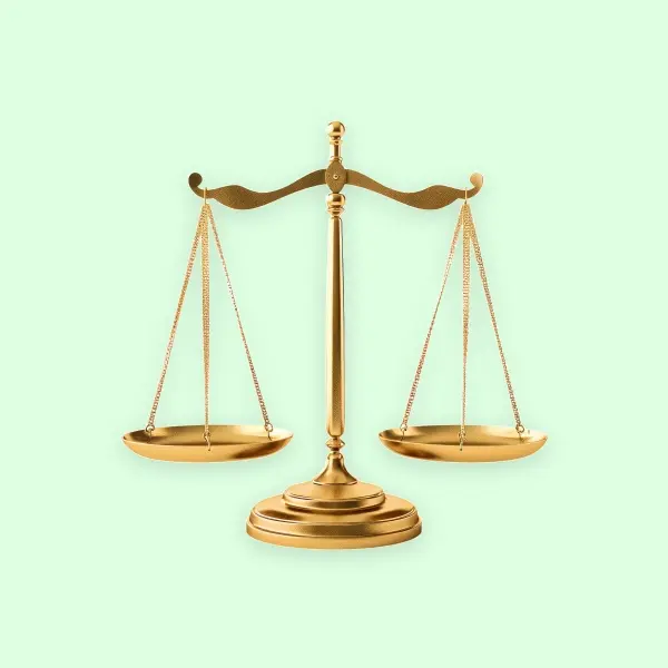 A gold balance scale on a light green background, symbolizing justice, fairness, or equality.